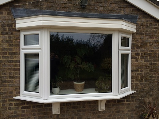Bay window in white PVC with fanlights